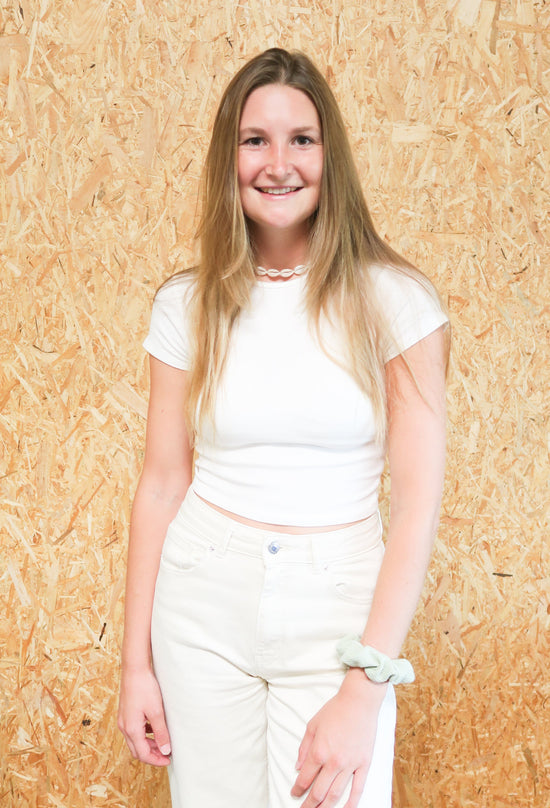 Soline Geist, Marketing content creator - beige/white clothes and long dark blond hair